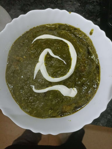 Tasty Saag Gosht cooked by COOX chefs cooks during occasions parties events at home