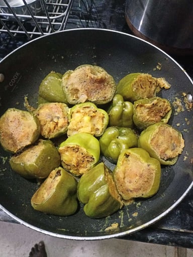Tasty Bharwa Shimla Mirch cooked by COOX chefs cooks during occasions parties events at home