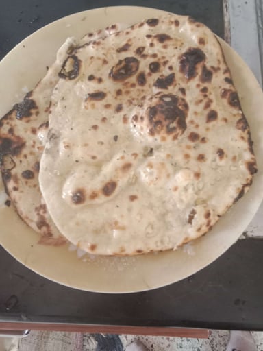 Tasty Naan (Butter / Garlic) cooked by COOX chefs cooks during occasions parties events at home