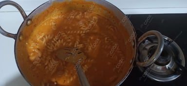 Tasty Chicken Pasta in Red Sauce cooked by COOX chefs cooks during occasions parties events at home