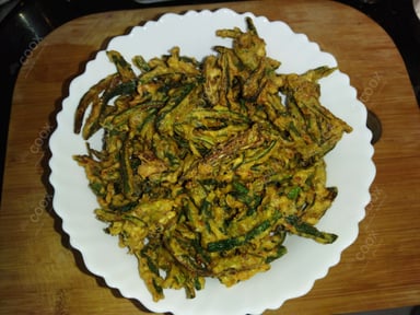 Tasty Kurkuri Bhindi cooked by COOX chefs cooks during occasions parties events at home