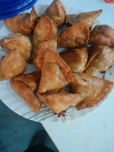 Tasty Keema Samosas cooked by COOX chefs cooks during occasions parties events at home