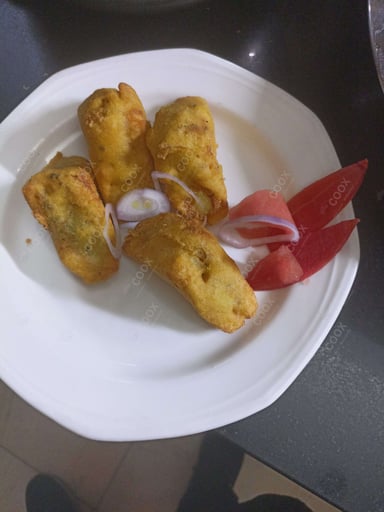 Tasty Bread Pakode cooked by COOX chefs cooks during occasions parties events at home