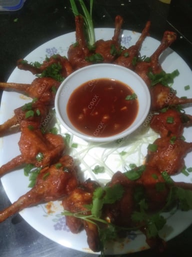 Tasty Chicken Lollipop cooked by COOX chefs cooks during occasions parties events at home