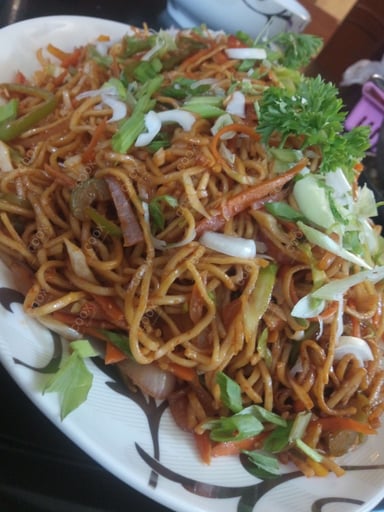 Tasty Chilli Garlic Noodles cooked by COOX chefs cooks during occasions parties events at home