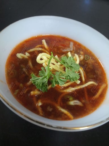 Tasty Vegetable Manchow Soup cooked by COOX chefs cooks during occasions parties events at home