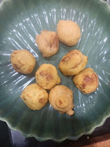 Tasty Aloo Bonda cooked by COOX chefs cooks during occasions parties events at home