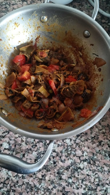 Tasty Karele ki Sabzi cooked by COOX chefs cooks during occasions parties events at home