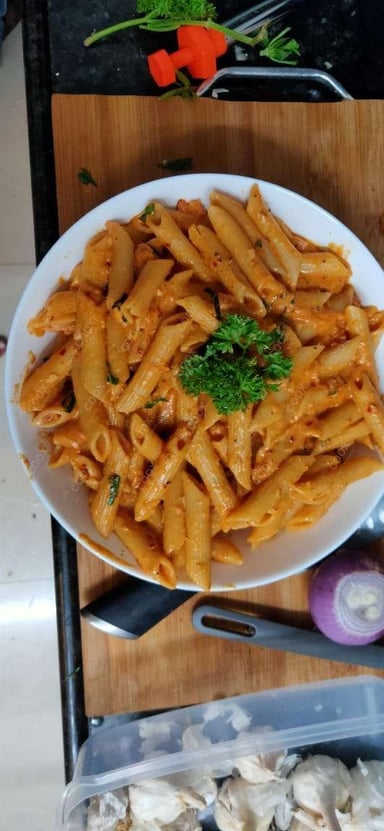 Tasty Pasta in Pink Sauce cooked by COOX chefs cooks during occasions parties events at home