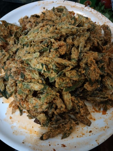 Tasty Kurkuri Bhindi cooked by COOX chefs cooks during occasions parties events at home