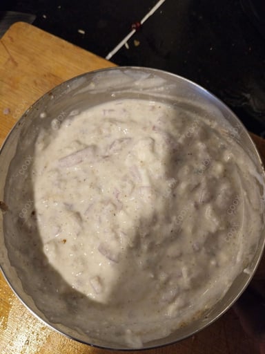 Tasty Onion Raita cooked by COOX chefs cooks during occasions parties events at home