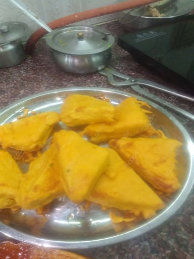 Tasty Bread Pakode cooked by COOX chefs cooks during occasions parties events at home