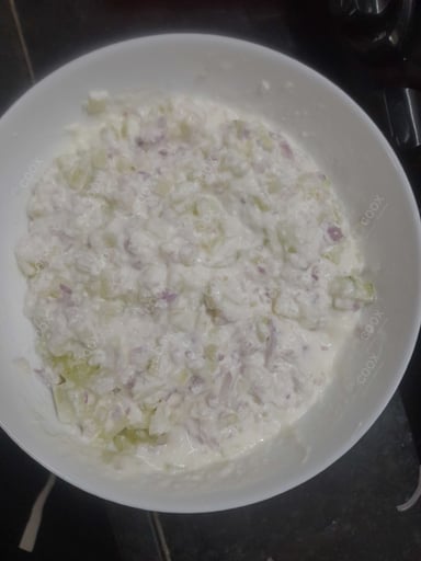 Tasty Onion Raita cooked by COOX chefs cooks during occasions parties events at home