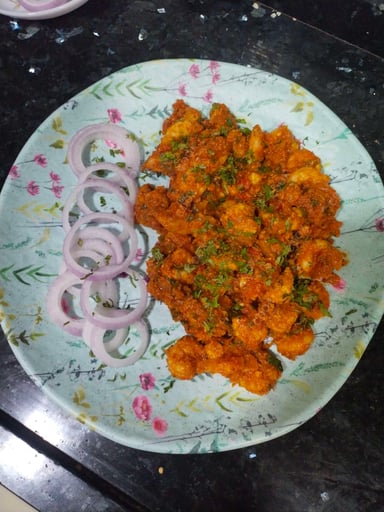 Tasty Red Chilli Prawns cooked by COOX chefs cooks during occasions parties events at home