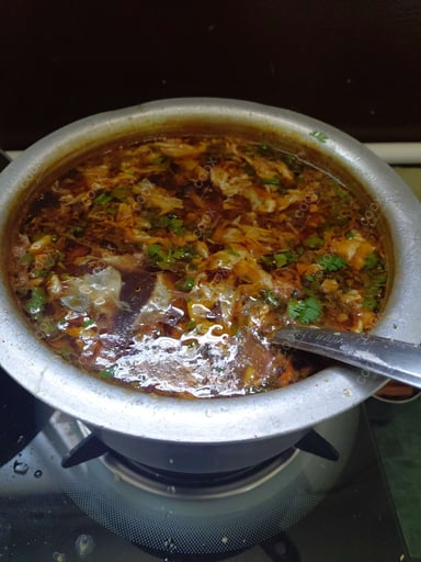 Tasty Chicken Manchow Soup cooked by COOX chefs cooks during occasions parties events at home