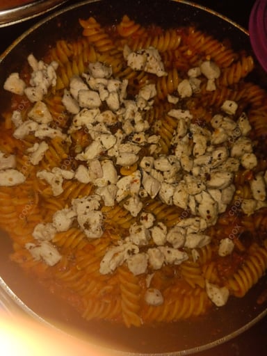 Tasty Chicken Pasta in Red Sauce cooked by COOX chefs cooks during occasions parties events at home
