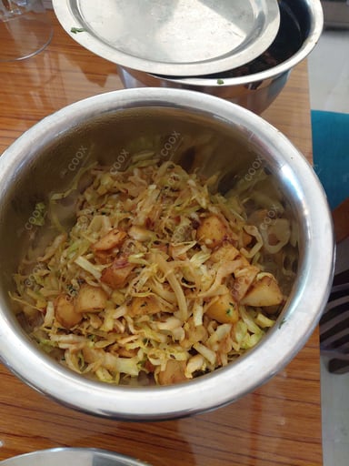 Tasty Aloo Patta Gobhi cooked by COOX chefs cooks during occasions parties events at home
