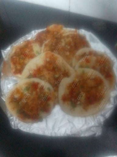 Tasty Mixed Veg Uttappam cooked by COOX chefs cooks during occasions parties events at home