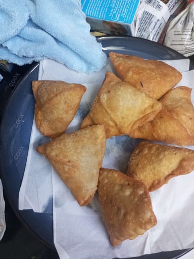 Tasty Keema Samosas cooked by COOX chefs cooks during occasions parties events at home