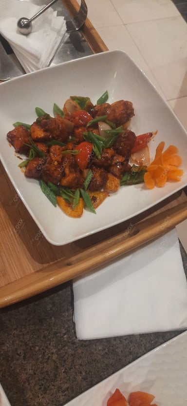 Tasty Chilli Chicken cooked by COOX chefs cooks during occasions parties events at home