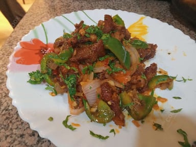 Tasty Crispy Chilli Lamb cooked by COOX chefs cooks during occasions parties events at home