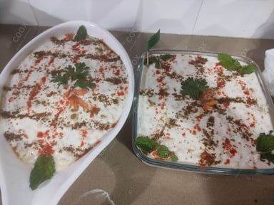 Tasty Boondi Raita cooked by COOX chefs cooks during occasions parties events at home