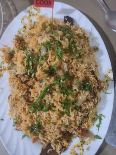 Tasty Chicken Biryani cooked by COOX chefs cooks during occasions parties events at home
