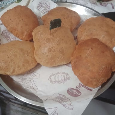 Tasty Pooris & Bedmis cooked by COOX chefs cooks during occasions parties events at home