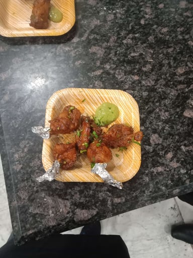 Tasty Chicken Lollipop cooked by COOX chefs cooks during occasions parties events at home