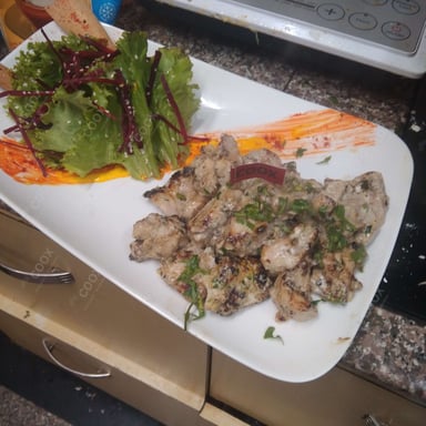 Tasty Murgh Malai Tikka cooked by COOX chefs cooks during occasions parties events at home