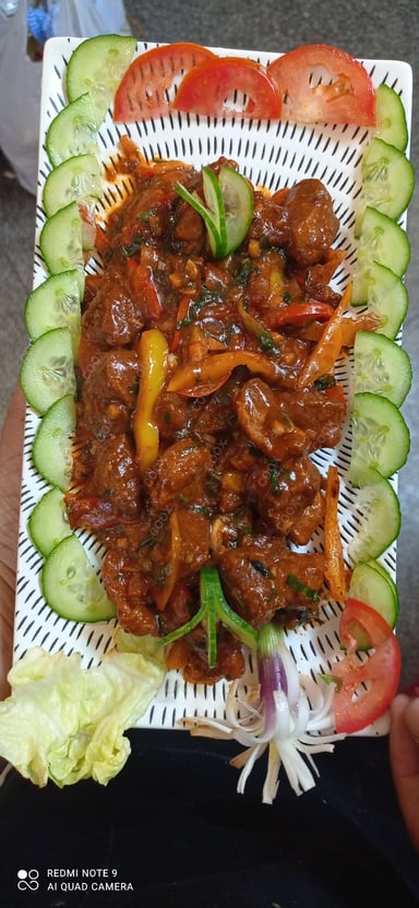 Tasty Crispy Chilli Lamb cooked by COOX chefs cooks during occasions parties events at home