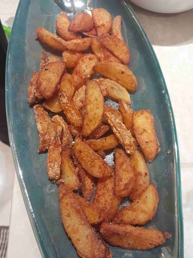 Tasty Potato Wedges cooked by COOX chefs cooks during occasions parties events at home