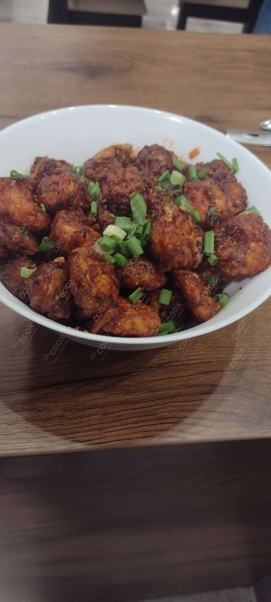 Tasty Red Chilli Prawns cooked by COOX chefs cooks during occasions parties events at home