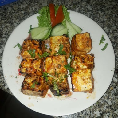 Tasty Paneer Tikka cooked by COOX chefs cooks during occasions parties events at home