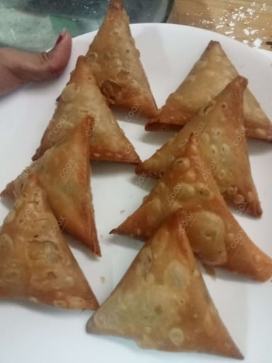 Tasty Keema Samosas cooked by COOX chefs cooks during occasions parties events at home