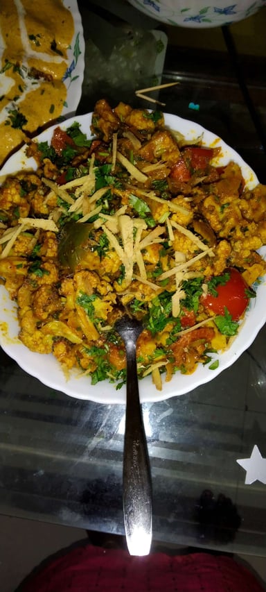 Tasty Adraki Gobhi cooked by COOX chefs cooks during occasions parties events at home