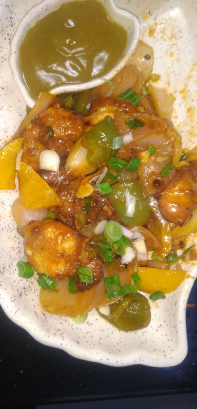 Tasty Chilli Chicken cooked by COOX chefs cooks during occasions parties events at home