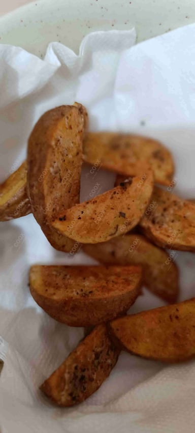 Tasty Potato Wedges cooked by COOX chefs cooks during occasions parties events at home