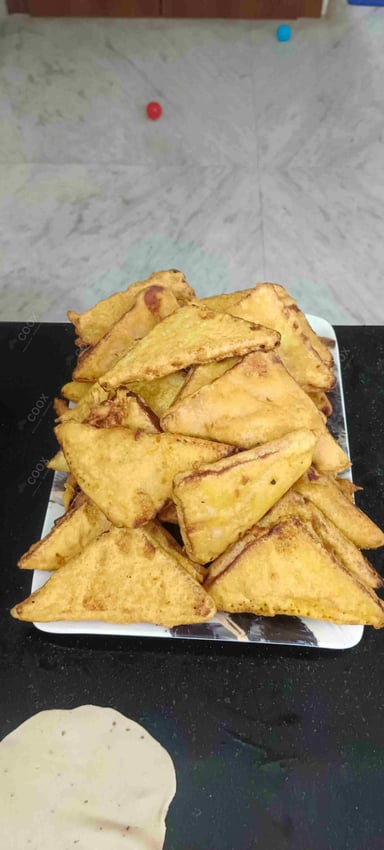 Tasty Bread Pakode cooked by COOX chefs cooks during occasions parties events at home