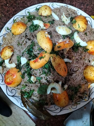 Tasty Egg Biryani cooked by COOX chefs cooks during occasions parties events at home