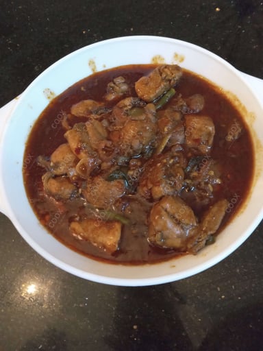 Tasty Chicken In Burnt Garlic Sauce cooked by COOX chefs cooks during occasions parties events at home