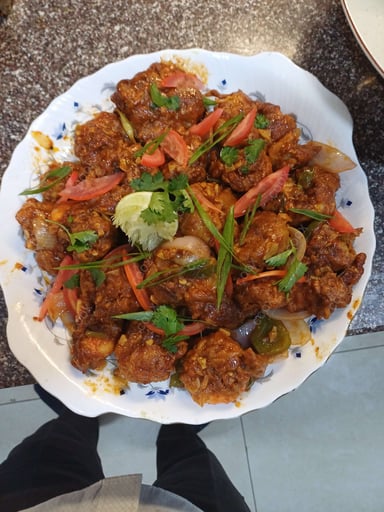 Tasty Red Chilli Prawns cooked by COOX chefs cooks during occasions parties events at home
