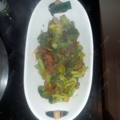 Tasty Masala Broccoli cooked by COOX chefs cooks during occasions parties events at home
