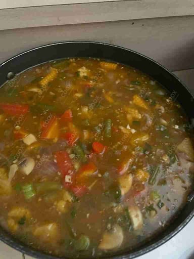 Tasty Mix Veg in Schezwan Sauce cooked by COOX chefs cooks during occasions parties events at home