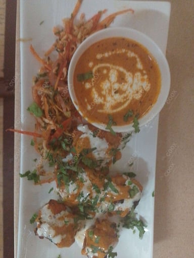 Tasty Murgh Malai Tikka cooked by COOX chefs cooks during occasions parties events at home