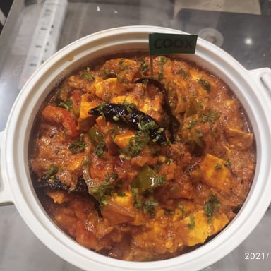 Tasty Kadhai Paneer cooked by COOX chefs cooks during occasions parties events at home