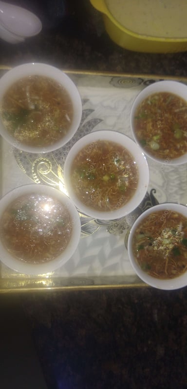 Tasty Chicken Manchow Soup cooked by COOX chefs cooks during occasions parties events at home