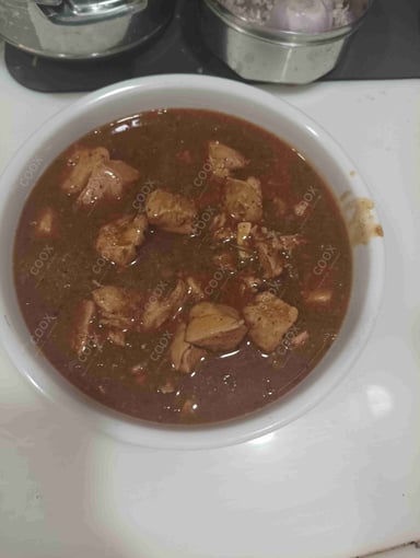 Tasty Chicken In Burnt Garlic Sauce cooked by COOX chefs cooks during occasions parties events at home