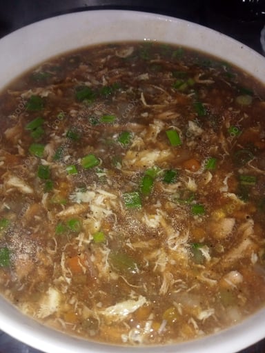 Tasty Chicken Manchow Soup cooked by COOX chefs cooks during occasions parties events at home