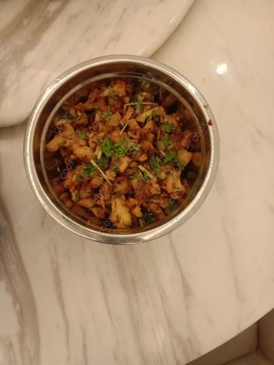 Tasty Adraki Gobhi cooked by COOX chefs cooks during occasions parties events at home